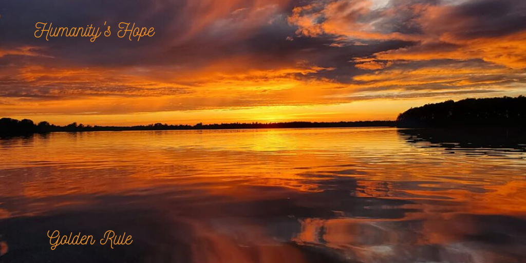 Sunrise over lake with purple clouds