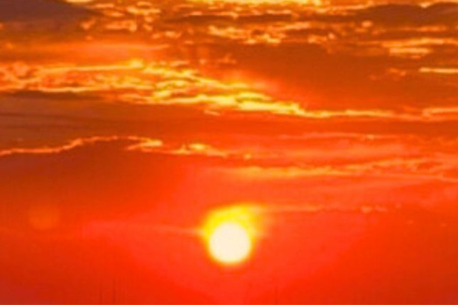 Red sky with yellow light in center